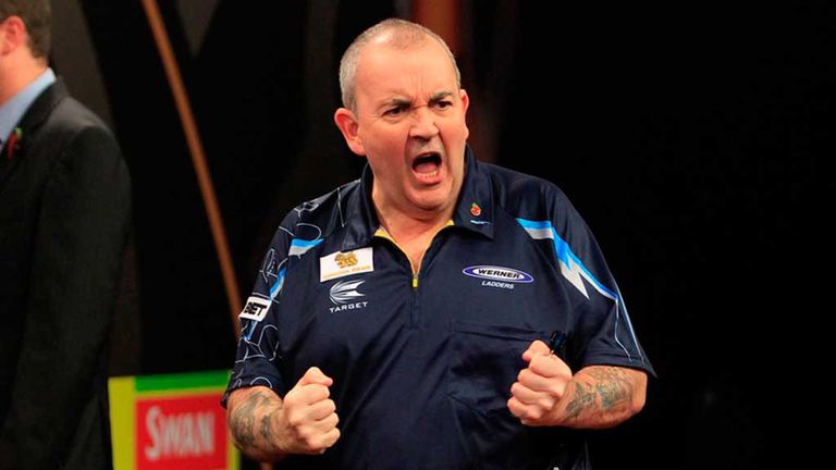 Phil Taylor celebrates his win over Christian Kist in the Grand Slam of Darts