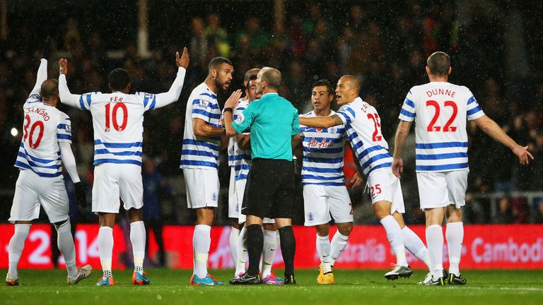 LONDON, ENGLAND - NOVEMBER 08:  QPR players protest to referee Mike Dean as Charlie Austin's goal is disallowed during the Barclays Premier League match be