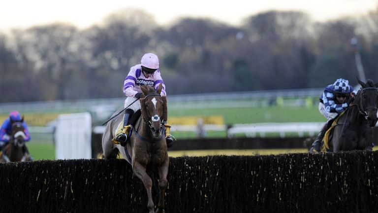 Silviniaco Conti (centre), ridden by Noel Fehily, pulls away from Menorah, ridden by Richard Johnson, to win the Betfair Chase at Haydock Racecourse.