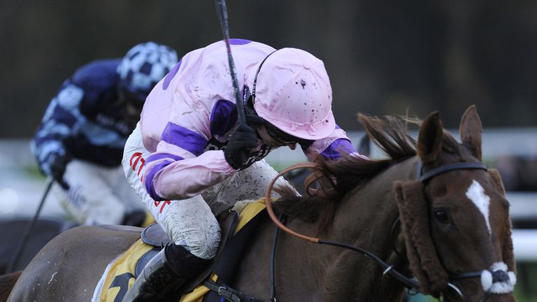 Silviniaco Conti (front), ridden by Noel Fehily, pulls away from Menorah, ridden by Richard Johnson, to win the Betfair Chase at Haydock Racecourse, Mersey