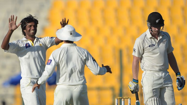Pakistan bowler Rahat Ali celebrates after taking the wicket of New Zealand batsman Jimmy Neesham during the fourth day of the first Test