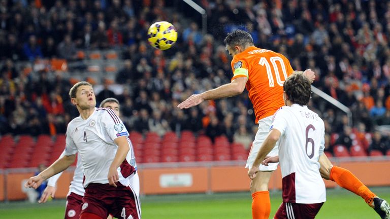 Robin van Persie heads home for Holland