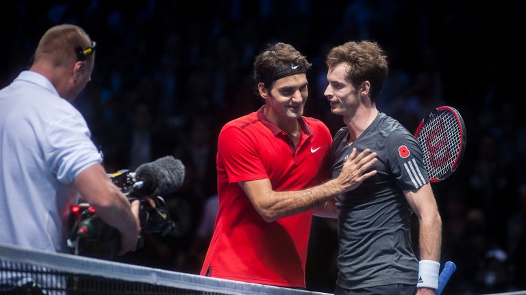 Andy Murray of Great Britain speaks with Roger Federer of Switzerland at the net after his 2-0 singles match defeat at the ATP World Tour Finals, O2 Arena