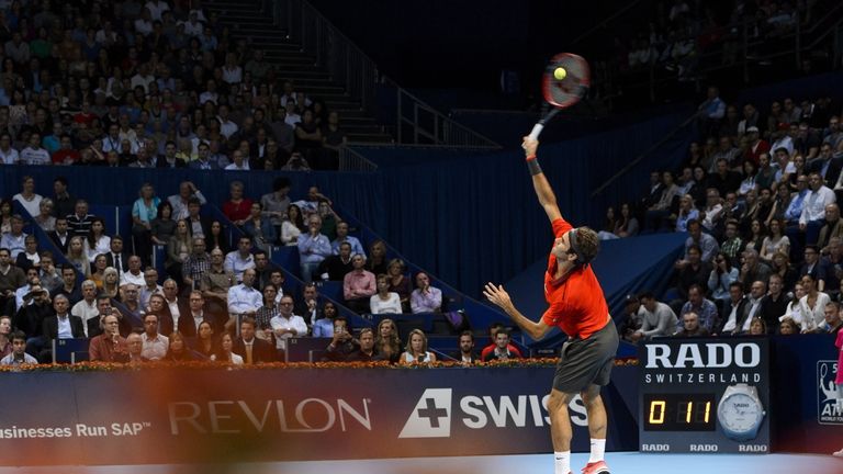 Roger Federer of Switzerland serves  during his final match against David Goffin of Belgium at the Swiss Indoors ATP tennis tournament on October 26, 2014 