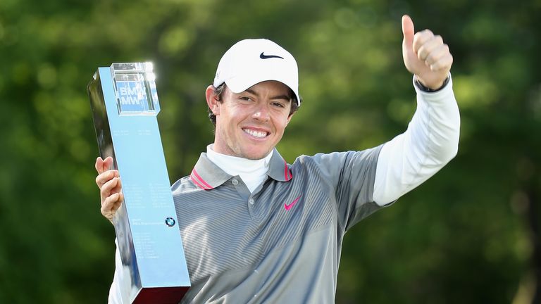 Rory McIlroy of Northern Ireland poses with the trophy following his victory at the end of day four of the BMW PGA Championship