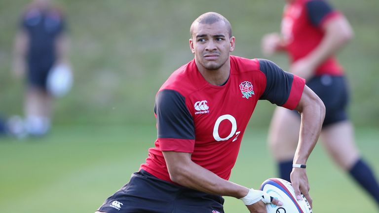 Jonathan Joseph passes the ball during the England training session held at Pennyhill Park on October 27, 2014 in Bagshot, 