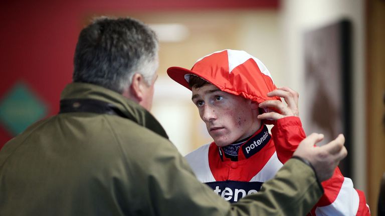 Jockey Sam Twiston-Davies chats with trainer Paul Nicholls