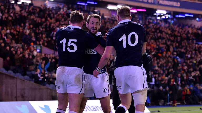 EDINBURGH, SCOTLAND - NOVEMBER 8: Stuart Hogg of Scotland celebrates scoring a Try with team mates Finn Russell and Greig Laidlaw during the International 