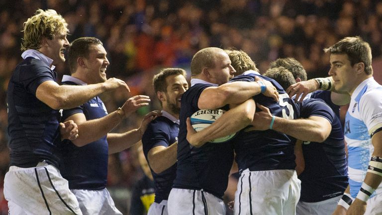 Scotland's Jonny Gray is mobbed by his team-mates as they celebrate his first try during the viagogo Autumn Test at the BT Murrayfield Stadium, Edinburgh.