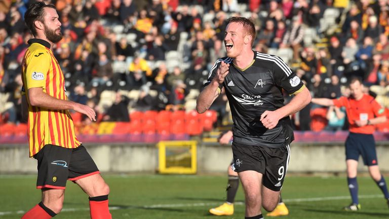 Adam Rooney celebrates after scoring from the penalty spot