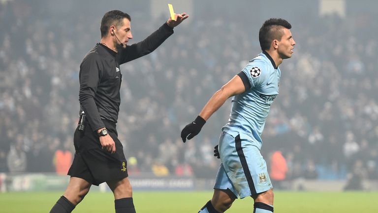 Manchester City's Sergio Aguero is booked for diving after going down under a challenge from CSKA Moscow's Sergey Ignashevich but a penalty is not given