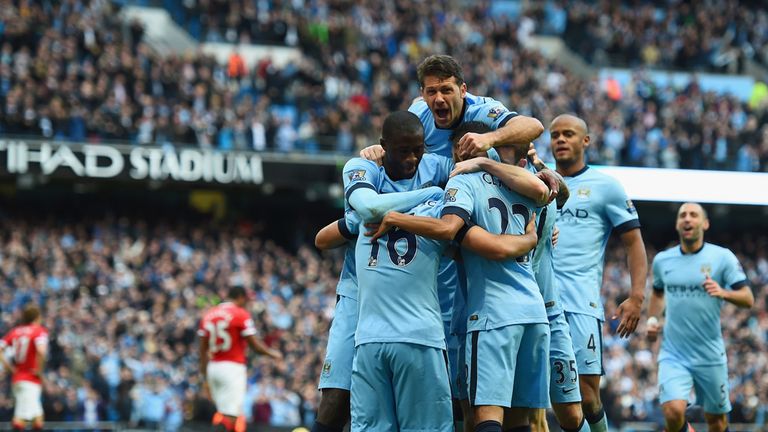 Sergio Aguero of Manchester City is mobbed by team mates a