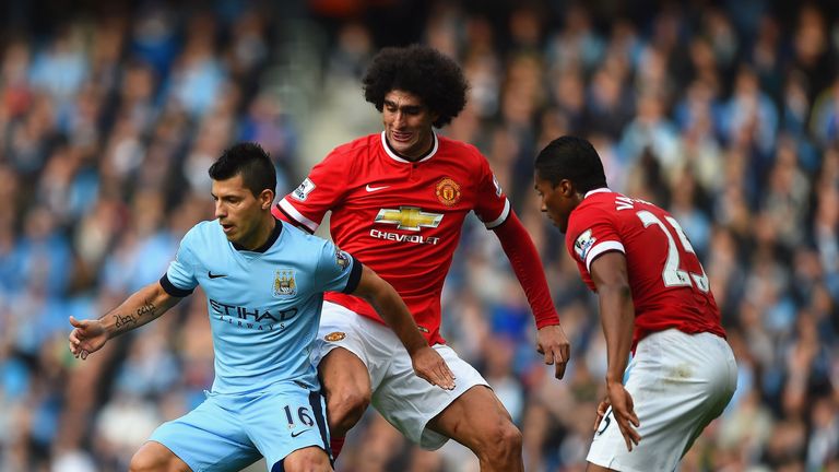 MANCHESTER, ENGLAND - NOVEMBER 02:  Sergio Aguero of Manchester City is closed down by Marouane Fellaini and Luis Antonio Valencia of Manchester United