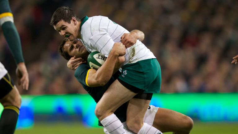 Jonathan Sexton of Ireland is tackled by Jan Serfontein of South Africa during the 2014 Guinness series International match at the Aviva Stadium