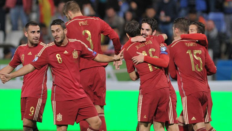 Spain celebrate Isco's opening goal against Belarus