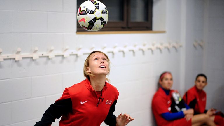 Stephanie Roche controls a ball in the locker room of her French Ligue 1 football club Albi 