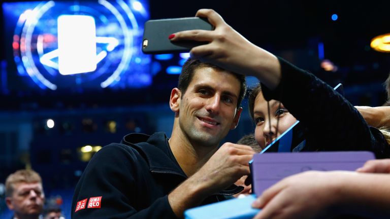 Novak Djokovic greets fans after the round robin singles match against Tomas Berdych at the ATP World Tour Finals