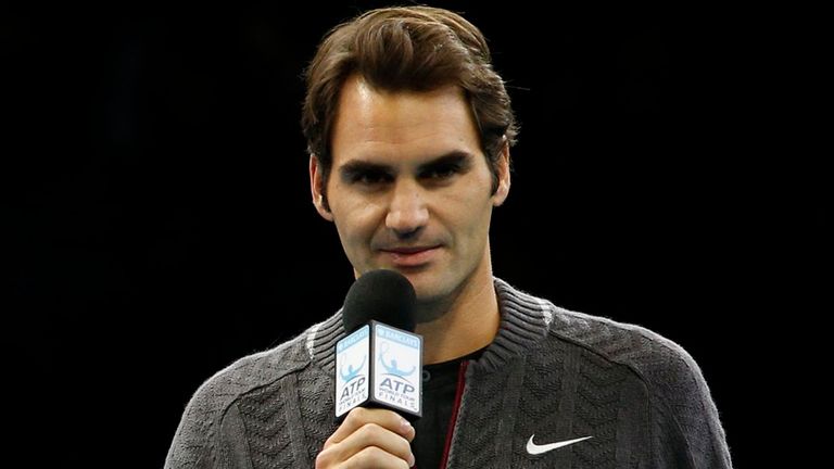 Roger Federer appears on court to apologise for being unable to compete in the singles final against Novak Djokovic during the ATP World Tour Finals