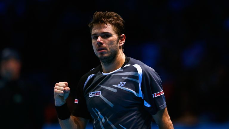 Stan Wawrinka celebrates match point in the round robin singles match against Marin Cilic at the ATP World Tour Finals