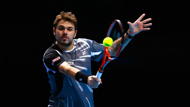 Stan Wawrinka plays a backhand in the round robin singles match against Novak Djokovic at the ATP World Tour Finals in London
