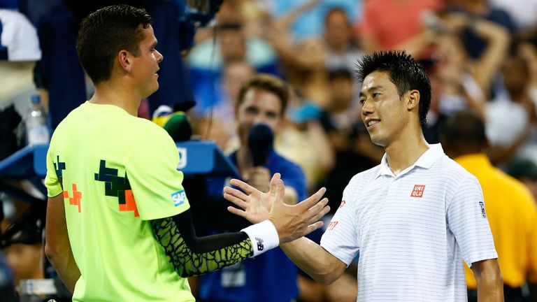 Kei Nishikori is congratulated by Milos Raonic at the 2014 US Open