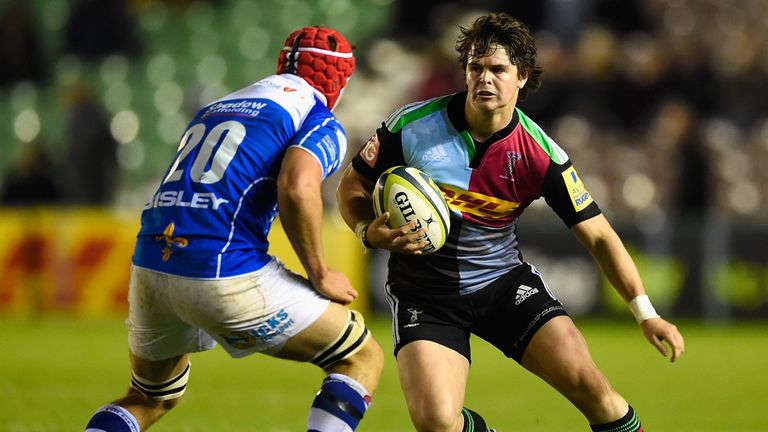 Fly half Tim Swiel of Harlequins is challenged by Ollie Griffiths of Newport during the LV= Cup match between Harlequins and Newport Gwent Dragons