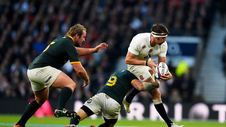 LONDON, ENGLAND - NOVEMBER 15: Tom Wood of England is tackled by Cobus Reinach of South Africa  during the QBE Intenational match between England and South