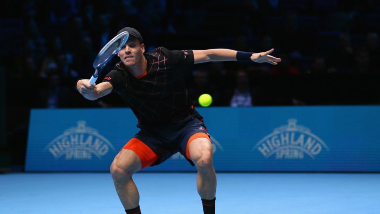 Tomas Berdych plays a forehand in the round robin singles match against Novak Djokovic at the ATP World Tour Finals in London
