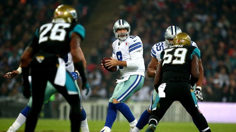 Tony Romo drops back into the pocket during the NFL week 10 match between the Jackson Jaguars and the Dallas Cowboys