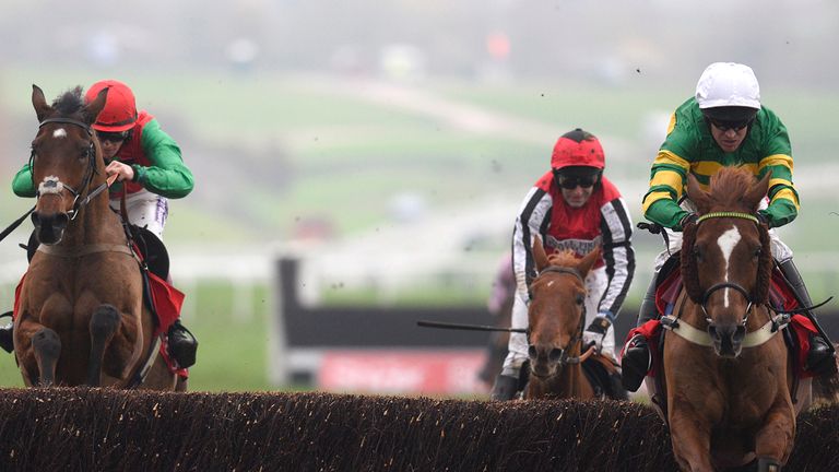 CHELTENHAM, ENGLAND - NOVEMBER 16: Barry Geraghty riding Uxizandre (R) clear the last to win The Shloer Steeple Chase at Cheltenham racecourse.