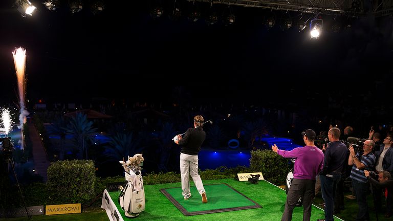 Victor Dubuisson hits off the balcony as Martin Kaymer watches on