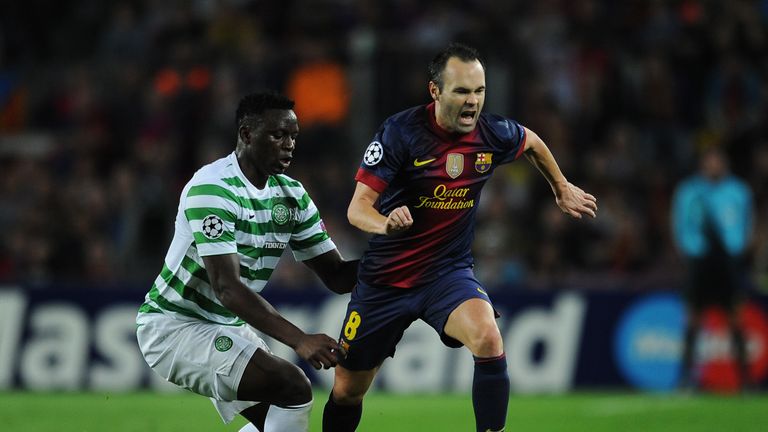 BARCELONA, SPAIN - OCTOBER 23:  Andres Iniesta (R) of Barcelona reacts as he duels for the ball with Victor Wanyama of Celtic FC during the UEFA Champions 