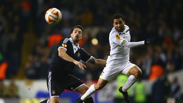 Vladimir Volkov of Partizan Belgrade and Aaron Lennon of Spurs battle for the ball during UEFA Europa League group C match between Tottenham and Partizan