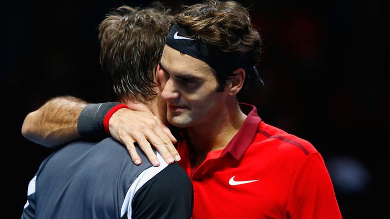 LONDON, ENGLAND - NOVEMBER 15:  Roger Federer of Switzerland hugs Stan Wawrinka of Switzerland afte the singles semi-final match  on day seven of the Barcl