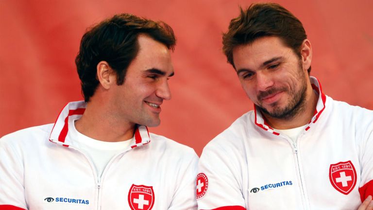 Roger Federer talks with Stan Wawrinka at the Davis Cup Final draw 2014