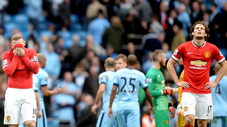 Manchester United's Wayne Rooney and Daley Blind appear dejected 