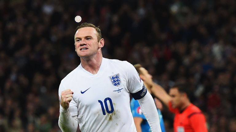 Wayne Rooney of England celebrates as he scores their first and equalising goal from a penalty during the European Qualifier v Slovenia at Wembley