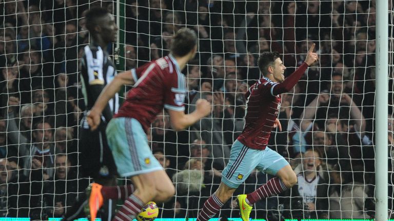 West Ham United's Aaron Cresswell (right) celebrates scoring his teams opening goal during the Barclays Premier League match at Upton Park, London.