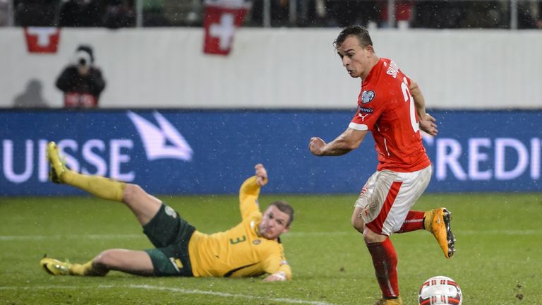 Switzerland's midfielder Xherdan Shaqiri scores the team's fourth goal against Lithuania