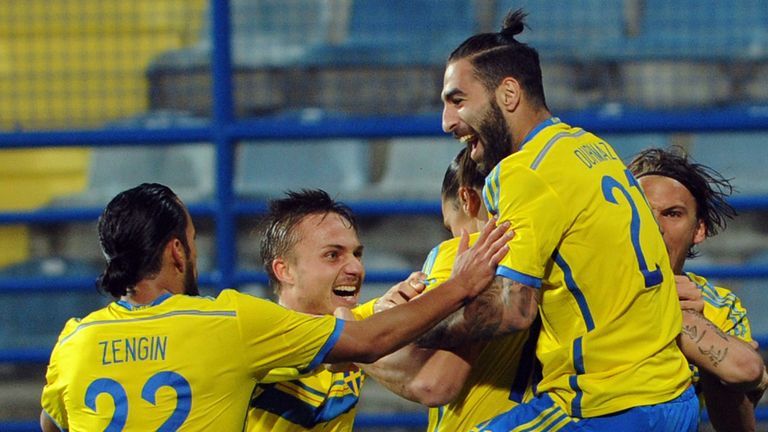 Zlatan Ibrahimovic is mobbed by his team-mates after scoring for Sweden against Montenegro in Podgorica