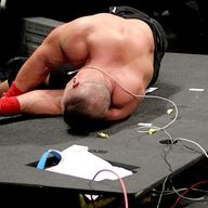 John Cena was left sprawled on the destroyed announce desk at the end of Raw