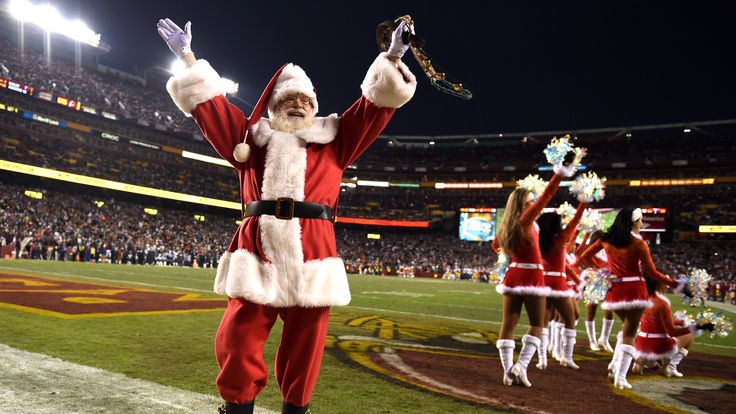 LANDOVER, MD - DECEMBER 20: Santa Claus acknowledges the crowd as the Philadelphia Eagles play the Washington Redskins at FedExField on December 20, 2014 i