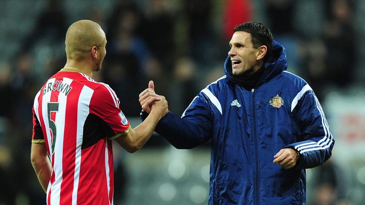 Sunderland manager Gus Poyet congratulates Wes Brown 