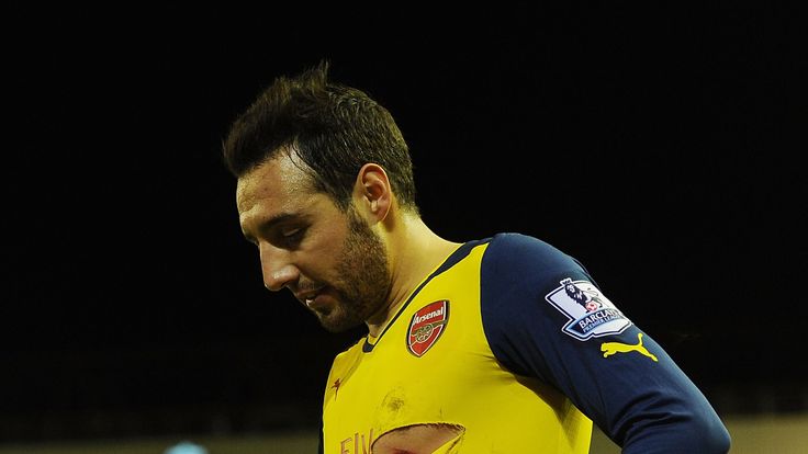Santi Cazorla with a ripped Arsenal shirt in Premier League match v Liverpool at Anfield