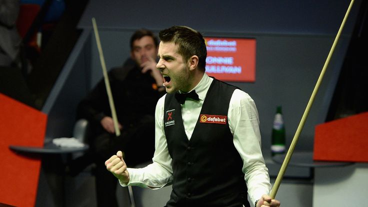 Mark Selby celebrates potting the final black to win The Dafabet World Snooker Championship final at Crucible Theatre