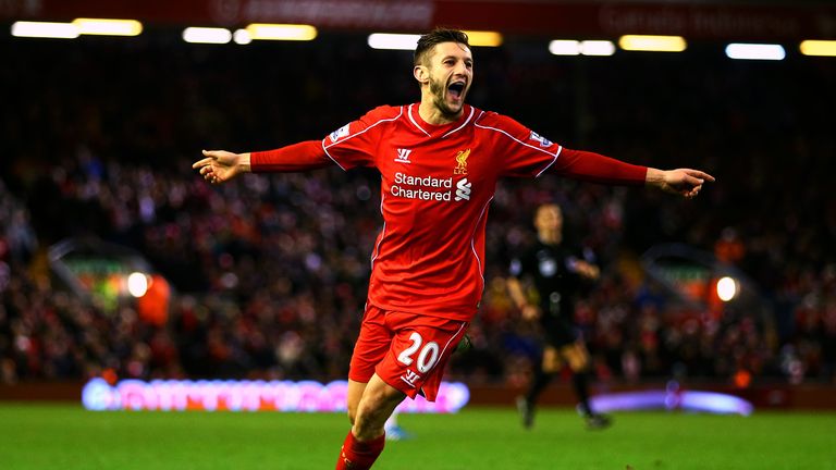 Adam Lallana of Liverpool celebrates after scoring his team's second goal during the Barclays Premier League match between Liverpool and Swansea City