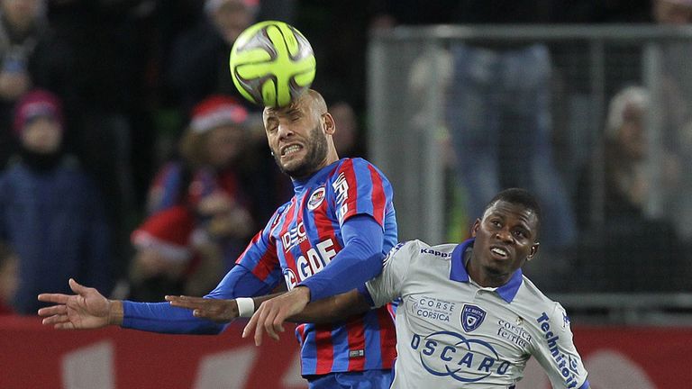 Caen's defender Alaeddine Yahia (L) vies for the ball with Bastia's French Togolese midfielder Floyd Ayite (R)