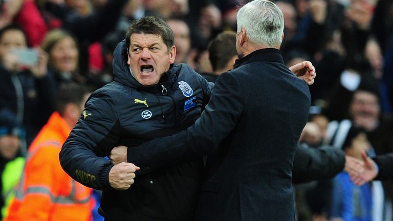 NEWCASTLE UPON TYNE, ENGLAND - DECEMBER 06:  Chelsea manager Jose Mourinho (r) looks on as Newcastle manager Alan Pardew celebrates with coach John Carver 
