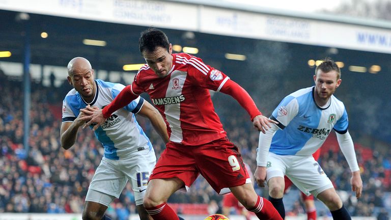 Alex Baptiste and Kike battle for the ball 