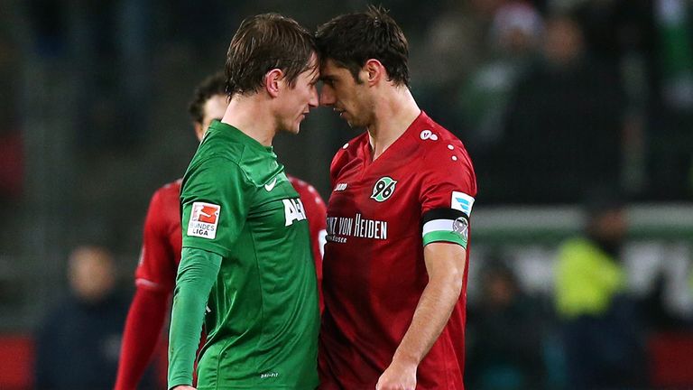 Augsburg's Dutch defender Paul Verhaegh (L) and Hanover's midfielder Lars Stindl (R) argue 